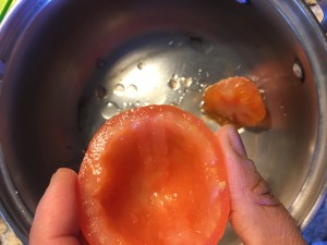 Scooping the tomatoes 