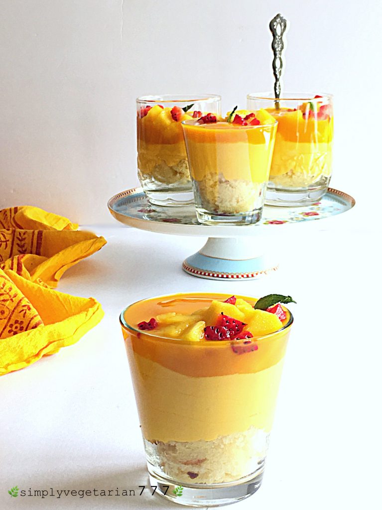 This Mango Cheesecake Trifle is very easy to make and super delicious. Most important part is that it is a No-Cook and No-Bake Recipe. It is a perfect dessert for your parties and get-togethers. #mangorecipes #cheesescake #mangocheesecake #nobakecheesecake #nocookcheesecake #triflerecipes #easydessert #mangodessert #cheesecake #summerdessert #nutfreedessert #easytrifle #partydessert #easycheesecake #nocookdessert 