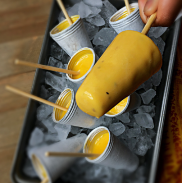 This Mango Kulfi No Cook Recipe is a perfect SUMMER TREAT. The best part is that it is made with just 3 ingredients and is super EASY + DELICIOUS. Make it for your family or make it to entertain your guests. You will make it again and again. It is that stupendously easy. #mangokulfi #kulfi #icecream #indiandessert #mangorecipes #condensedmilk