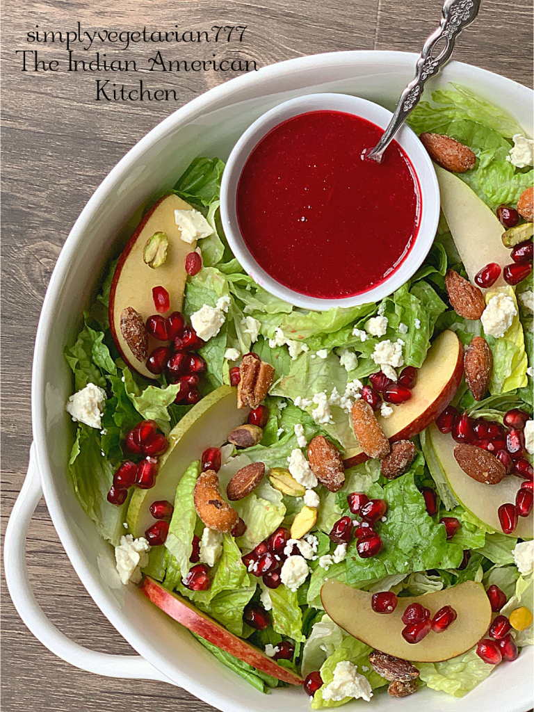 This Holiday Salad is a perfect Salad to make for your Holiday Entertaining. It is colorful, well textured and super delicious. Homemade Cranberry Vinaigrette is cooked partially in Instant Pot and is finger-licking good. #holidaysalad #cranberryrecipes #vinaigretterecipe #holidayrecipes #easyholidayside #instantpotholidayrecipe