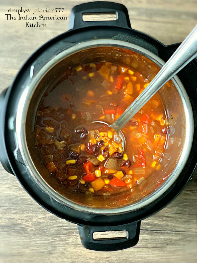 Vegetarian Enchilada Soup is just perfect for this cold weather. The best part is that it is made in Instant Pot. And it is a dump and go kind of recipe. Just 5 minutes of Cookig time in Instant Pot and a hearty filling dinner is ready in no time. #vegetariansoup #enchiladasoup #vegetarianenchiladasoup #instantpotenchiladasoup #instantpotsoup #easymeals #vegetariandinner