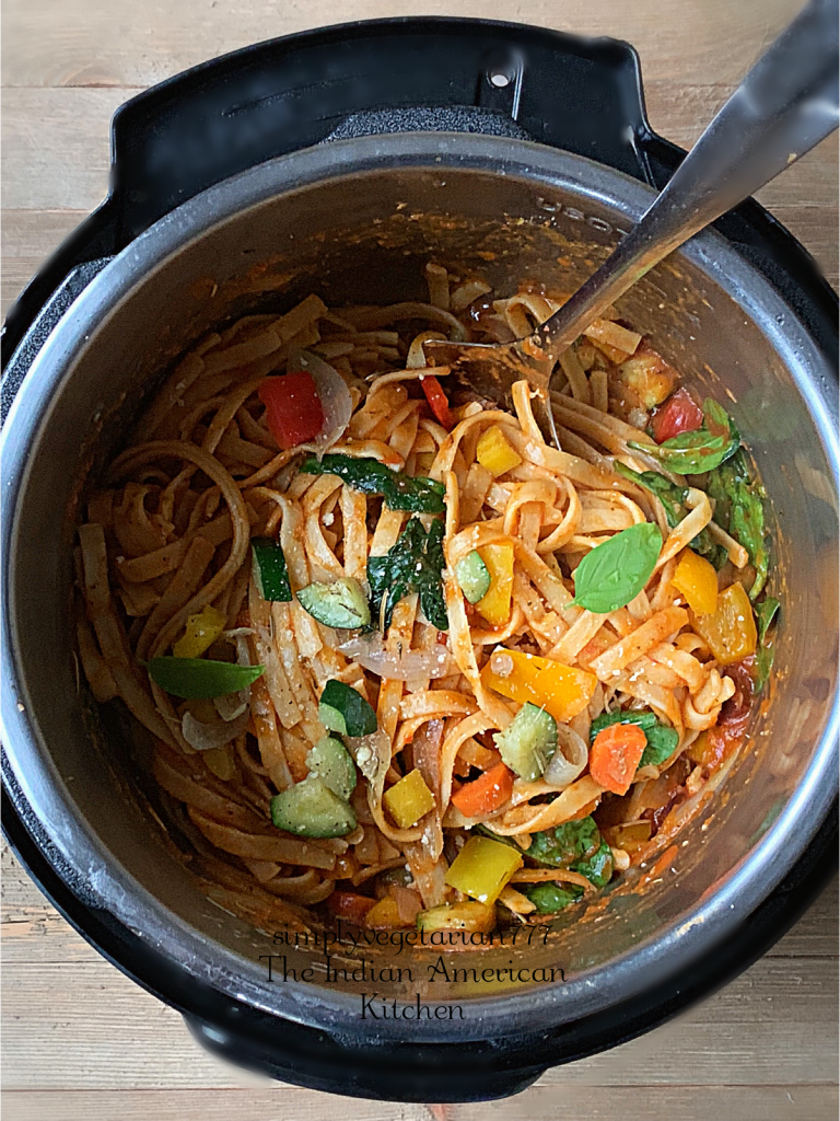 Instant Pot Pasta Primavera made with Rainbow Carrots and other Seasonal Vegetables is a perfect recipe for the Holiday Season. Serve it for Thanksgiving or any Dinner night. It is simply delicious. #instantpotpasta #thanksgivingrecipe #pastaprimavera #fettucine #Vegetablepasta #holidaypasta