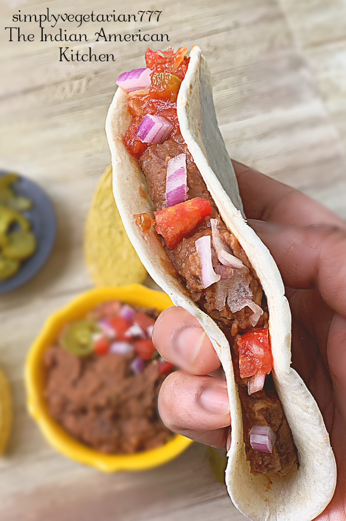 This 3 Ingredients Refried Beans Instant Pot Recipe is a keeper recipe. All the Tex Mex food lovers will love this VEGAN REFRIED BEANS recipe. It is quick, easy and needs no prep at all. Just dump it all in your Instant Pot and you have the best REFRIED BEANS ever. #instantpotrefriedbeans #veganrefriedbeans #mexicanbeans #easybeans #pintobeans