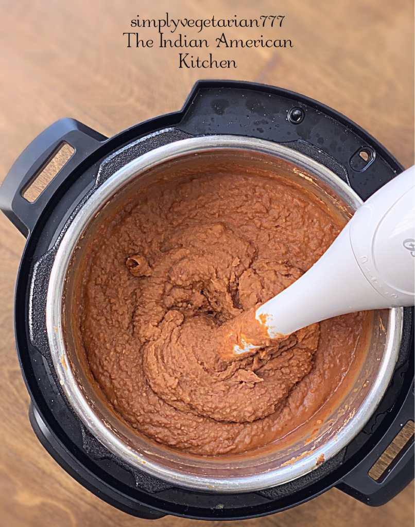 This 3 Ingredients Refried Beans Instant Pot Recipe is a keeper recipe. All the Tex Mex food lovers will love this VEGAN REFRIED BEANS recipe. It is quick, easy and needs no prep at all. Just dump it all in your Instant Pot and you have the best REFRIED BEANS ever. #instantpotrefriedbeans #veganrefriedbeans #mexicanbeans #easybeans #pintobeans